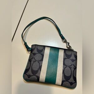 Coach Corner Zip Wristlet canvas with a varsity stripe in a dark navy and teal